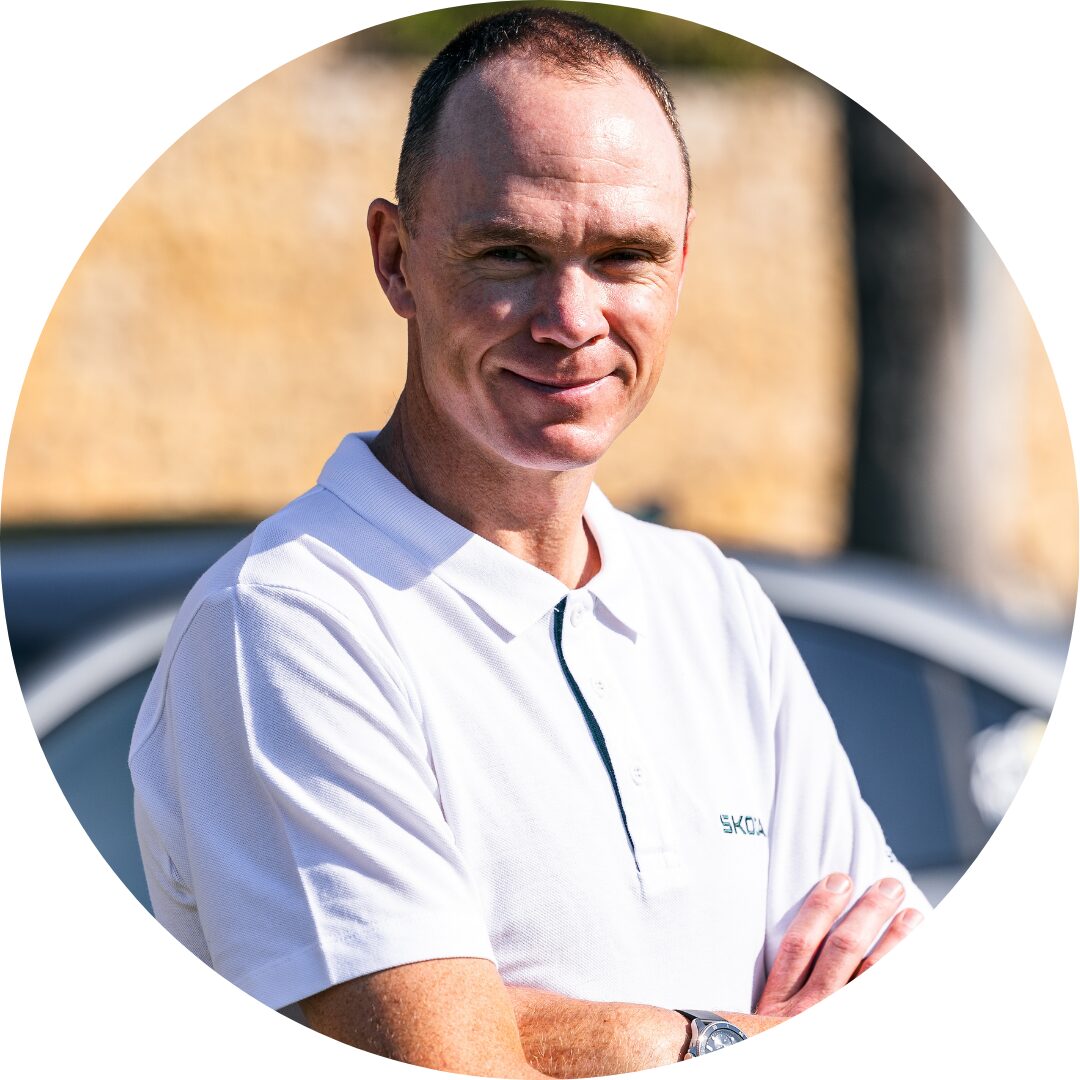 Chris Froome Black-and-white head-and-shoulders portrait of Sven Huberts, smiling at the camera and wearing a black button-up shirt, shown against a light background within a circular frame.